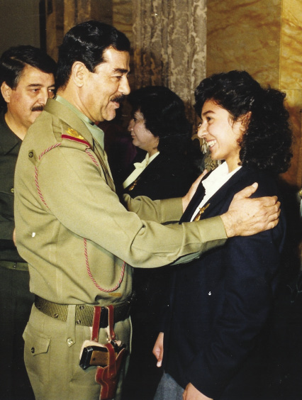 A young Zainab Salbi with former family acquaintance Saddam Hussein