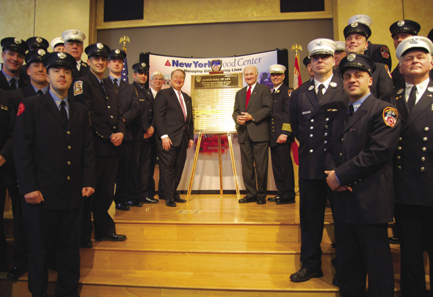 Howard P. Milstein, in his role as Chairman of the Board of the New York Blood Center (NYBC), honors New York City firefighters who donated lifesaving bone marrow and stem cells at NYBC’s annual “Honor Roll of Life” ceremony.