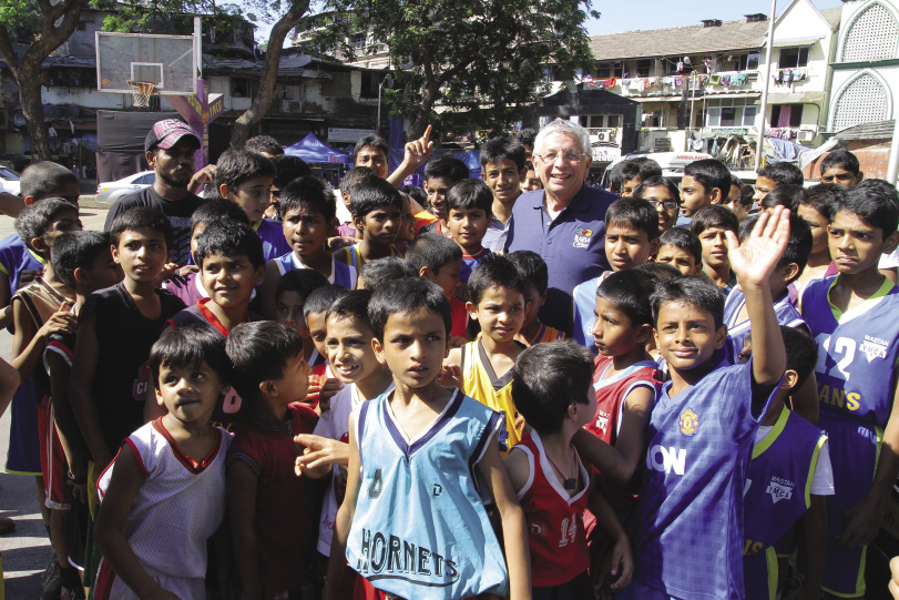 David Stern visits with children at the Mastan YMCA in Mumbai, India