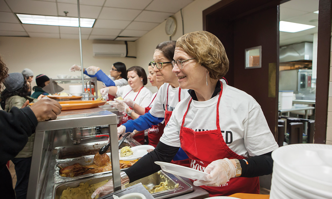 United Way of New York City’s Women’s Leadership Council volunteering at the Bowery Mission