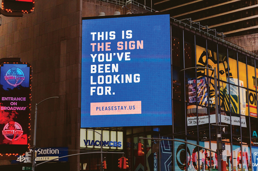 Billboard in Times Square featuring Please Stay messaging