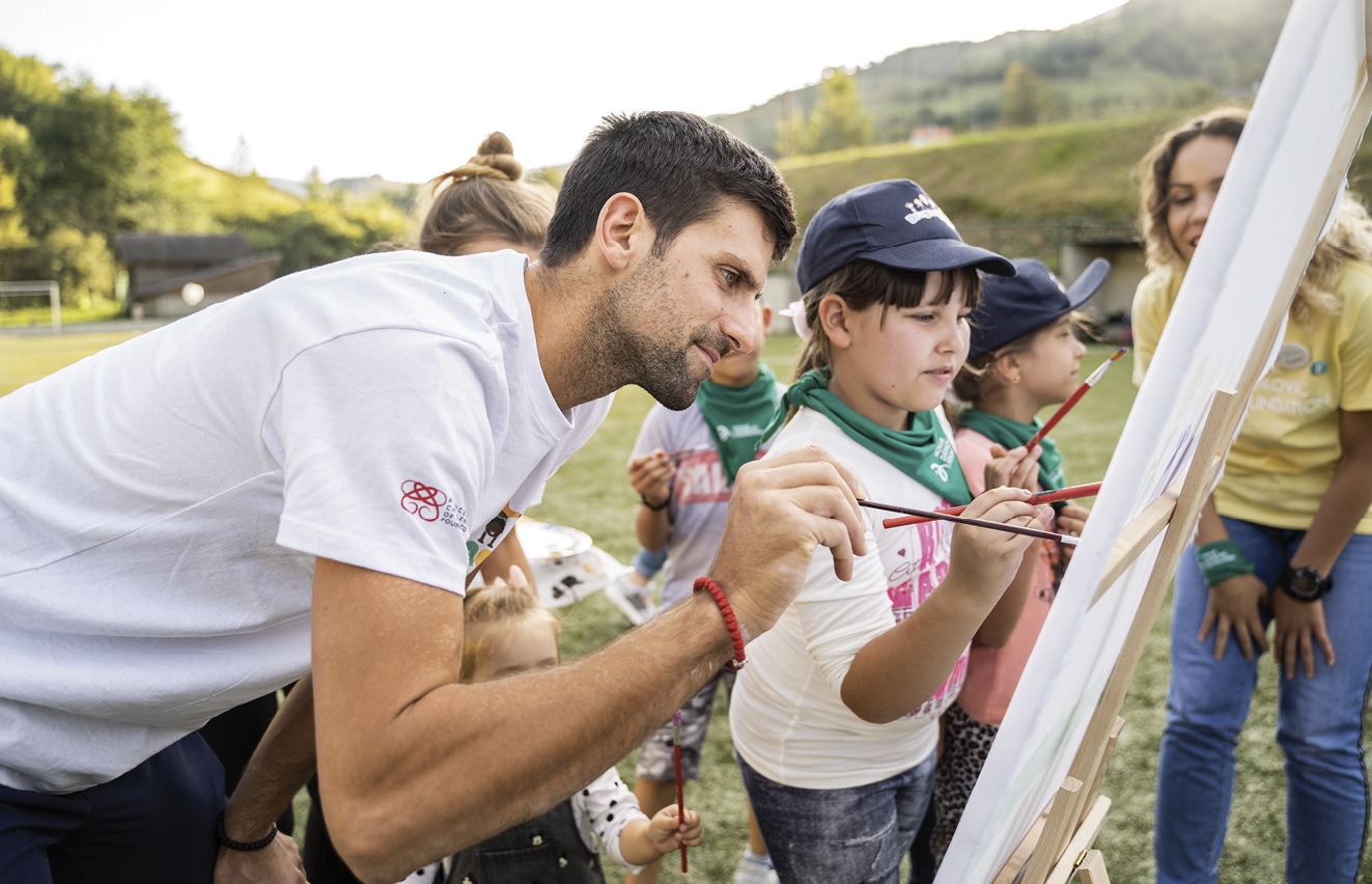 Novak Djokovic painting with children at Friendship Games on Kopaonik mountain