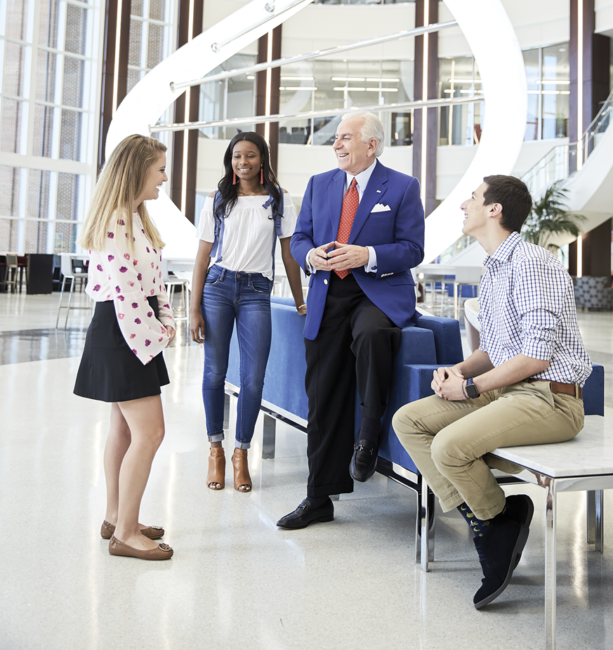 Dr. Qubein talks with students at HPU