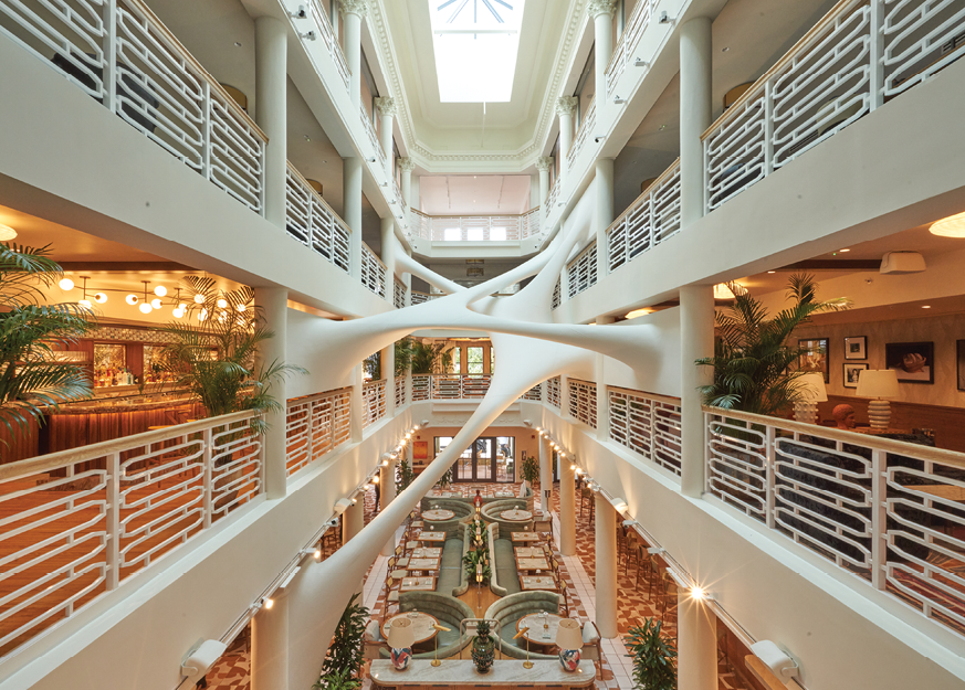 A spiral staircase in a building with a large atrium.

AI generated content